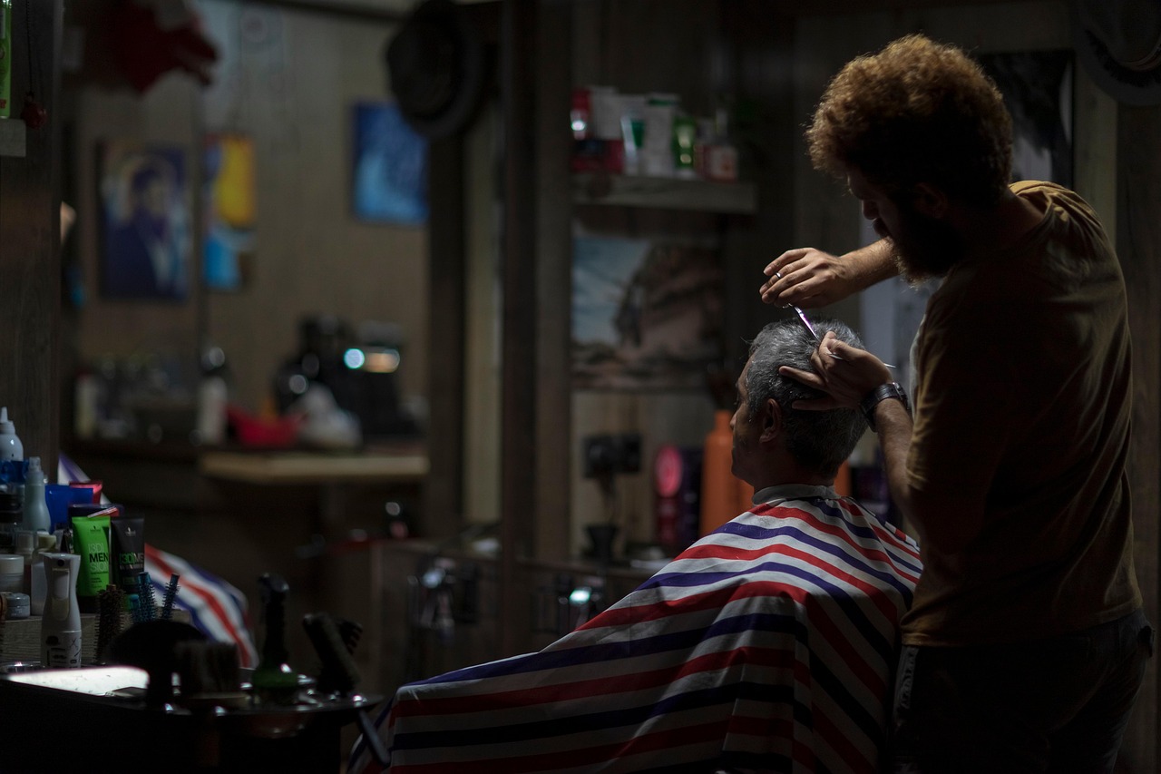 A stylist cutting a client's hair